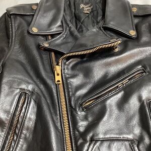 Black Leather Jacket with Gold Accents